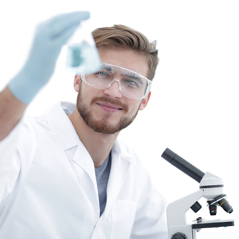 photo of lab technician examining test sample in a beaker