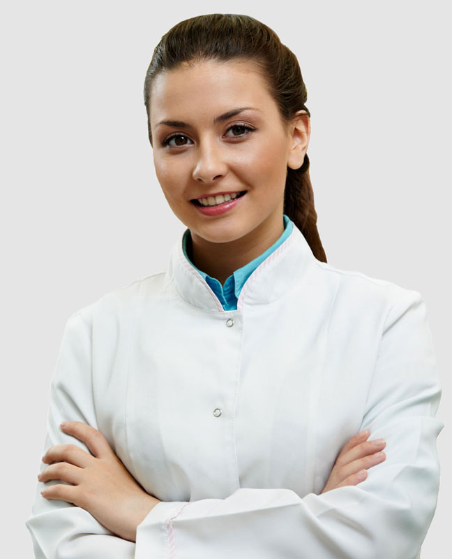 photo of smiling female pharma employee wearing white labcoat